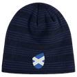 The EMB Canterbury Scotland Shield Beanie is a navy blue knit hat featuring horizontal stripes and a small blue and white shield emblem with the Scottish flag.
