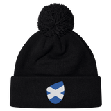 The EMB Canterbury Scotland Shield Pom Pom Beanie is black with a cozy knit design, featuring the Scotland Shield badge on the front, adding national pride.