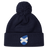 The Scotland Shield Pom Pom Beanie by EMB Canterbury, in navy blue, features a Scottish flag emblem on the front, offering warmth and national pride.