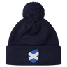 The Scotland Shield Pom Pom Beanie by EMB Canterbury, in navy blue, features a Scottish flag emblem on the front, offering warmth and national pride.
