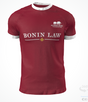 The Alabama Rugby Foundation Red Match Jersey by Custom GIL AXI is a red rugby shirt with white collar and cuffs, "Alabama Rugby Foundation" and an elephant logo on the left chest, and "BONIN LAW" across the front.