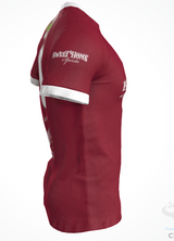 Side view of the Custom GIL AXI Alabama Rugby Foundation Red Match Jersey, a maroon short-sleeve shirt with white trim and "SWEET HOME Spirits" printed on the sleeve.