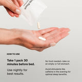 A person pours capsules from a white Momentous Nightly Sleep 5-Pack into their hand; instructions note nightly, non-habit forming use before bed.
