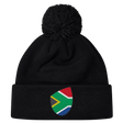 The South Africa Shield Pom Pom Beanie by EMB Canterbury is a stylish black beanie with a front cuff patch showcasing the iconic South Africa shield, combining style and pride in one cozy accessory.