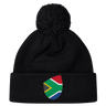 The South Africa Shield Pom Pom Beanie by EMB Canterbury is a stylish black beanie with a front cuff patch showcasing the iconic South Africa shield, combining style and pride in one cozy accessory.