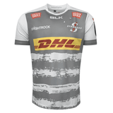 Front of Grey jersey with white accents and sleeves and white brush style hoops on the bottom part of jersey. Stormers logo on left chest, Brightrock logo on right chest, BLK logo below neck centered. Six Gun Grill on each shoulder
