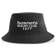 Introducing the Hornets Rugby Club 1977 Sustainable Bucket Hat by EMB S&S Activewear—a black casual bucket hat featuring "hornets RUGBY CLUB 1977" embroidered in white on the front, crafted from recycled polyester for a stylish and eco-friendly accessory.