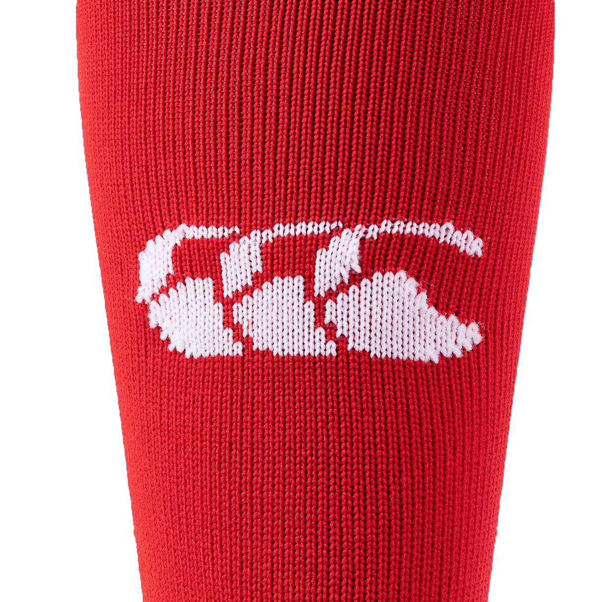 Close-up of a red Canterbury Playing Sock featuring a white CCC logo, characteristic of the Canterbury brand.