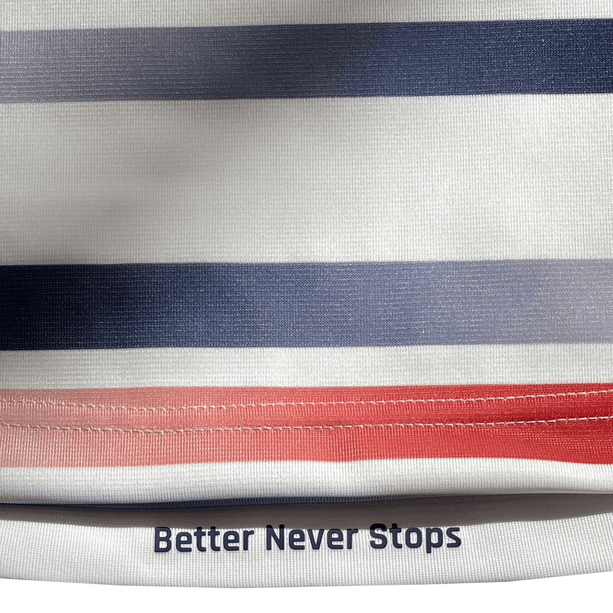 Close-up of the Women's USA Rugby Pro Home Jersey by Castore featuring horizontal stripes in blue and red shades. The sublimated design includes "Better Never Stops" printed at the bottom.