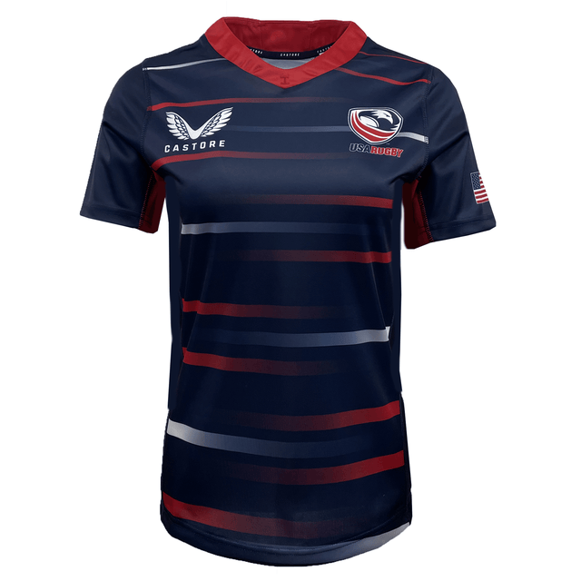 Navy blue Women's USA Rugby Pro Away Jersey by Castore with red and white stripes, featuring the USA Rugby logo, Castore logo, and an American flag patch on the sleeve.