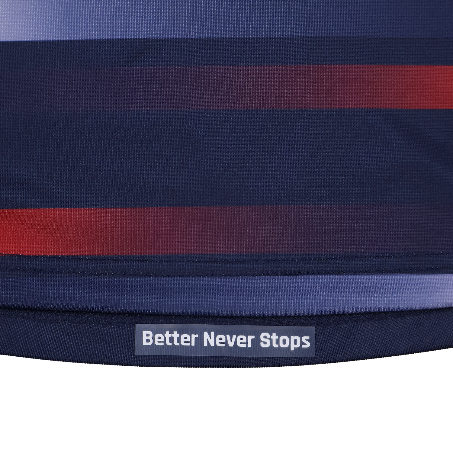 The Women's USA Rugby Pro Away Jersey 22/23 by Castore, in navy with red and blue stripes, features a "Better Never Stops" label near the hem in white text.