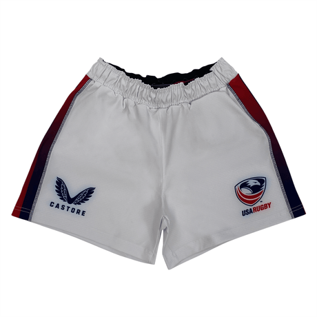 The Women's USA Rugby 22/23 Pro Home Shorts by Castore feature red and navy side panels, a Castore logo on the left leg, and the USA Rugby eagle crest on the right—ideal for fans and players.