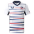 The Women's USA Rugby Replica Home Jersey 22/23 by Castore features horizontal red, navy, and gray stripes, USA Rugby chest logos, and an American flag on the sleeve.