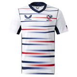 The Women's USA Rugby Replica Home Jersey 22/23 by Castore features horizontal red, navy, and gray stripes, USA Rugby chest logos, and an American flag on the sleeve.