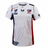 The Women's USA Rugby 22/23 RWC Home Pro Jersey by Castore is a white jersey with red and blue accents, featuring the USA Rugby logo, Castore branding, and an American flag on the sleeve.