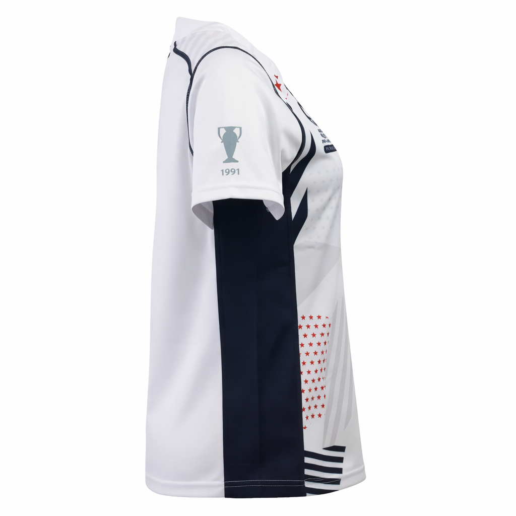 Side view of the Women's USA Rugby 22/23 RWC Home Pro Jersey by Castore in white with navy accents, featuring a "1991" trophy graphic on the sleeve and red stars on the front.