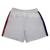 The Women's USA Rugby 22/23 RWC Pro Home Shorts by Castore feature a white design with an elastic waistband, red stripe on the left, and navy blue stripe on the right, shown from the back.