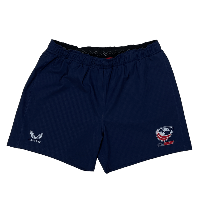 Women's USA Rugby RWC Pro Away Shorts by Castore in navy blue, featuring USA Rugby and Castore logos. Comes with a mouth guard pocket for convenience and a silicone waist grip for a snug fit during intense matches.