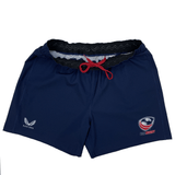 The Women's USA Rugby RWC Pro Away Shorts by Castore are navy blue with a red drawstring, featuring USA Rugby and Castore logos. They include a silicone waist grip for a better fit and come with a handy mouth guard pocket.
