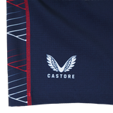 Close-up of a navy blue fabric with the Castore logo and white/red geometric lines, from the Women's USA Rugby 22/23 7s RWC Away Pro Short by Castore.