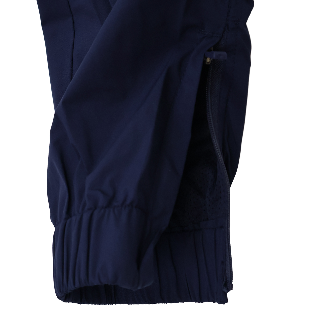 Close-up of a navy blue jacket sleeve with a zipper and elastic cuff, ideal for pairing with Castore’s Womens USA Rugby Weather-resistant Pant, against a plain background.