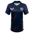 The Women's USA Rugby Authentic Home Jersey by Castore is a navy blue jersey with red accents, featuring the USA Rugby logo on the right chest and "Castore" on the left. Made from moisture-wicking fabric, it keeps you cool and comfortable during intense matches.