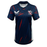 The Women's USA Rugby Authentic Home Jersey by Castore is a navy blue jersey with red accents, featuring the USA Rugby logo on the right chest and "Castore" on the left. Made from moisture-wicking fabric, it keeps you cool and comfortable during intense matches.