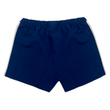 Rear view of Women's USA Rugby Pro Home Shorts by Castore in blue, featuring an elastic waistband, white side stripes, and moisture-wicking fabric. Ideal for fans seeking style and comfort.