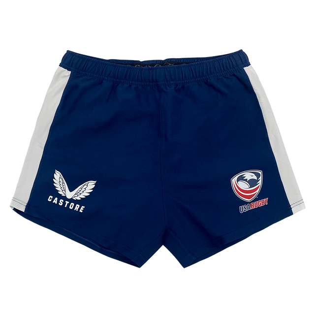Women's USA Rugby Pro Home Shorts by Castore, in navy blue, showcase Castore logos on the front. They feature a comfortable elasticated waistband and are made from moisture-wicking fabric to ensure lasting comfort.