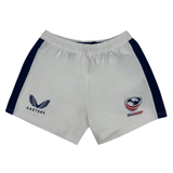 The Women's USA Rugby Pro Away Shorts by Castore are white with navy side panels, featuring the Castore logo on the left and the USA Rugby emblem on the right. Perfect for any enthusiast.