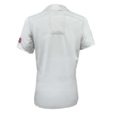 Back view of Women's USA Rugby Training Jersey by Castore with a small American flag patch on the left sleeve, crafted from moisture-wicking fabric for comfort.