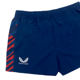 The Women's USA Rugby Pro Home Shorts by Castore are navy blue with red and blue diagonal side stripes, an elastic waistband, and a white logo of stylized wings above "CASTORE." Made from moisture-wicking fabric to ensure comfort on the field.