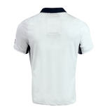 The image displays the back of a white short-sleeved Women's USA Rugby Pro Away Jersey by Castore, featuring dark collar and sleeve accents in a classic style.
