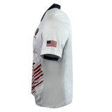 Side view of the Women's USA Rugby Pro Away Jersey by Castore, a white rugby jersey with red and navy accents and a USA flag on the right sleeve, perfect for stylishly showcasing your support for USA Rugby.