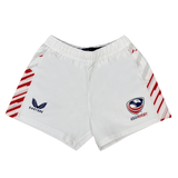 Elevate your style and performance with the Women's USA Rugby Pro Away Shorts by Castore. These white shorts boast a USA Rugby logo on the right, a Castore logo on the left, and bold red diagonal side stripes, making them a standout choice on and off the field.