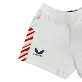 White Women's USA Rugby Pro Away Shorts by Castore, featuring red diagonal stripes and a navy Castore logo with wings, capture a sporty style ideal for training or watching USA Rugby matches.
