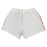 The Women's USA Rugby Pro Away Shorts by Castore, featuring red striped accents on the sides, are shown from the back and are perfect for women's rugby gear.