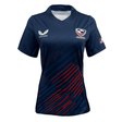 The Women's USA Rugby 24/25 Pro 7's Home Jersey by Castore features a navy design with red diagonal stripes, a white Castore logo on the left chest, an eagle emblem on the right chest, and an American flag on the left sleeve.