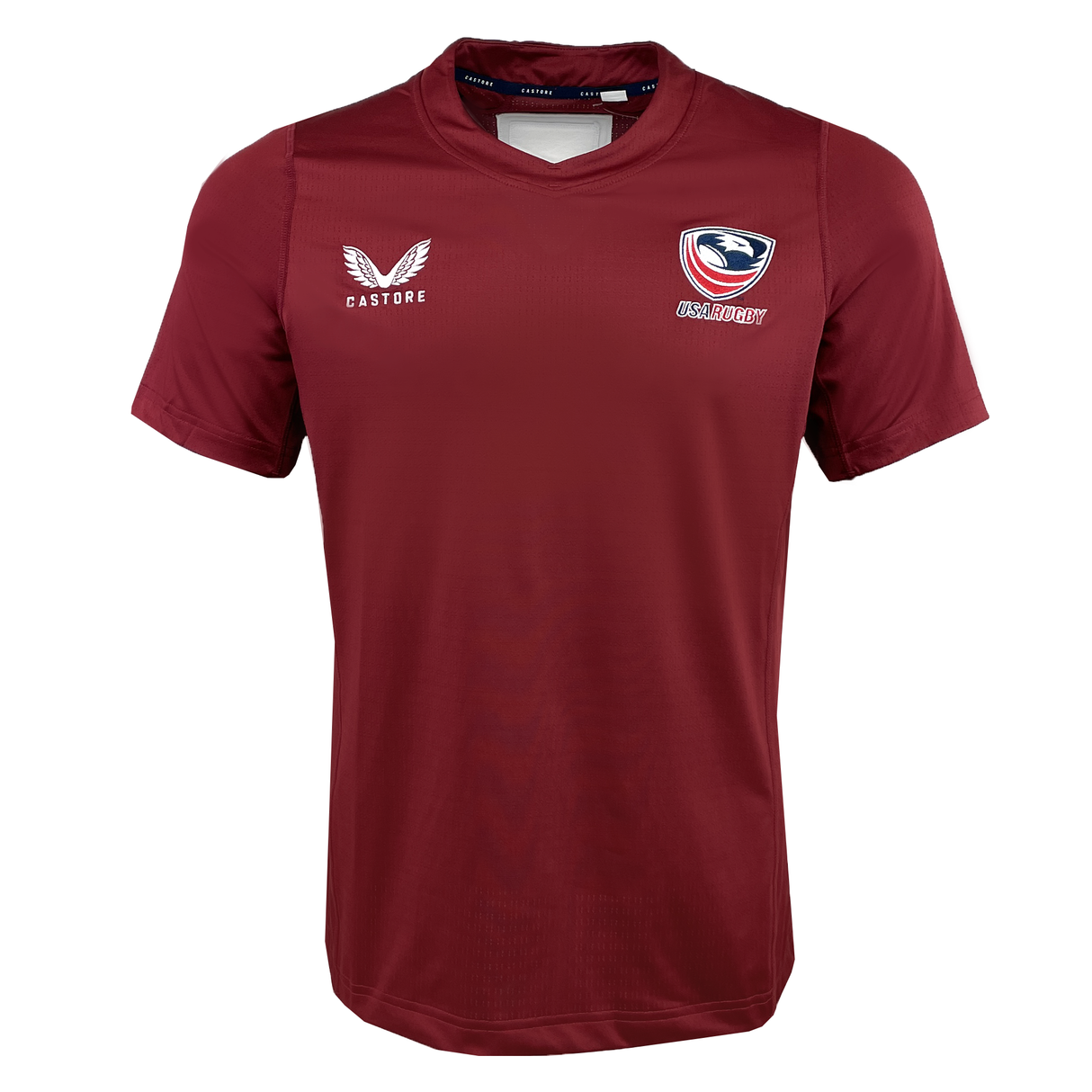 The Women's USA Rugby Pro Training Jersey by Castore is a burgundy jersey with moisture-wicking fabric, featuring the iconic Castore logo on the left and an eagle emblem with "USA Rugby" on the right.