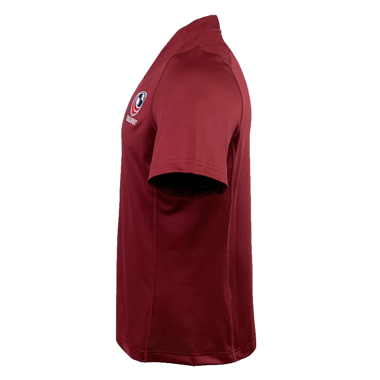 Side view of the maroon Women's USA Rugby Pro Training Jersey by Castore, showcasing a circular logo on the chest, made from moisture-wicking fabric.