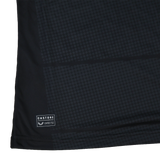 Close-up of the Women's Saracens Home Replica Jersey 24/25 by Castore, in black with a subtle square dot pattern and a small Castore label near the bottom hem.