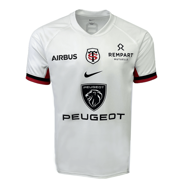 The Stade Toulousain Replica Away Jersey by Nike is a white jersey that showcases logos for Airbus, Rempart Mutuelle, and Peugeot. It features the iconic red and black emblem with intertwined letters.