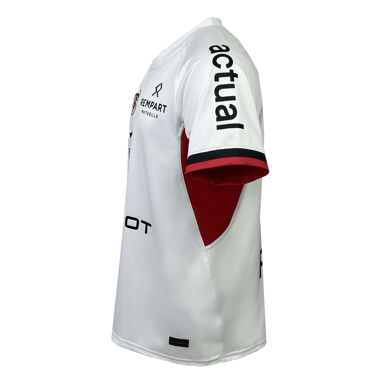 The Stade Toulousain Replica Away Jersey by Nike is a white, short-sleeved jersey featuring "actual" in black on the right sleeve and various other logos. It includes red panels on the underarm sections and a red accent on the left sleeve cuff, showcasing Stade Toulousain's iconic style.