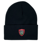 A Nike RC Toulon Cuffed Beanie with a folded brim featuring a red and white embroidered crest that reads "Toulon RCT" alongside a design of three flowers.