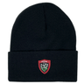 A Nike RC Toulon Cuffed Beanie with a folded brim featuring a red and white embroidered crest that reads "Toulon RCT" alongside a design of three flowers.