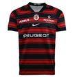 The Nike Stade Toulousain 25/26 Replica Home Jersey features black and red horizontal stripes, Airbus, Rempart, Peugeot logos, and the classic "ST" crest—an ideal pick for fans.