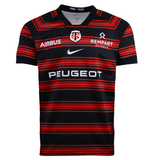 The Nike Stade Toulousain 25/26 Replica Home Jersey features black and red horizontal stripes, Airbus, Rempart, Peugeot logos, and the classic "ST" crest—an ideal pick for fans.