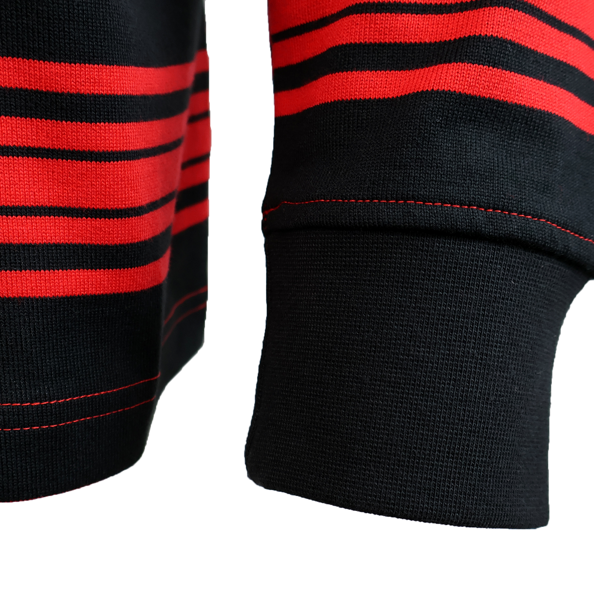 Close-up of the Nike Stade Toulousain 25/26 Heritage Long Sleeve Rugby Jersey in black with red horizontal stripes and visible red stitching on the cuff and hem.