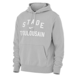 The Nike Stade Toulousain 25/26 Premium Pullover Hoodie features a light gray design, front pocket, and white Nike logo on the chest—combining comfort and sporty style for dedicated rugby fans.