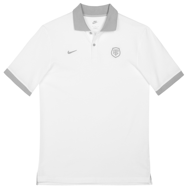The Nike Stade Toulousain 25/26 Premium Pique Polo is a white short-sleeve shirt with a grey collar and sleeve trim, featuring a small grey Nike logo and the Stade Toulousain crest on the left chest.